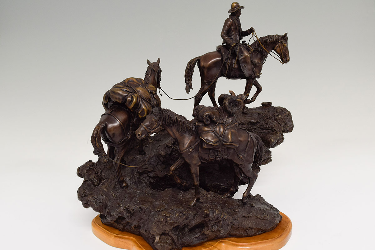 Bronze sculpture of horses climbing rocky trails by James P Regimbal