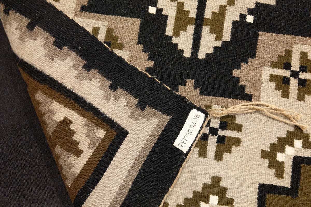 Black, brown, and tan Navajo rug